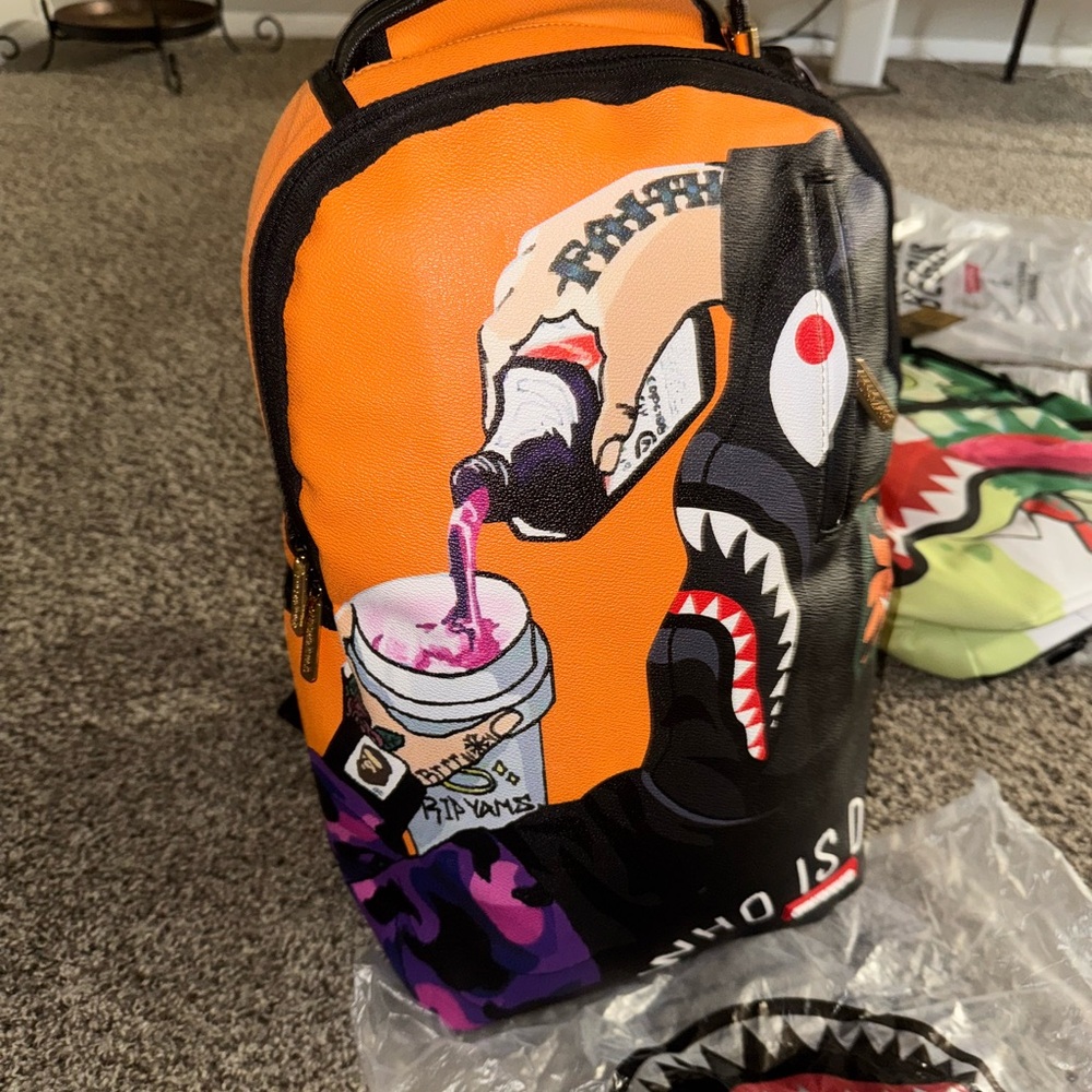 New Sprayground BAPE Orange and Black Graphic Backpack